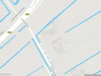 Ambulance met grote spoed naar de Korte Dwarsweg in Ouderkerk aan de Amstel