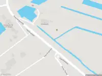 Ambulance met gepaste spoed naar de Vlaardingsedijk in Maassluis