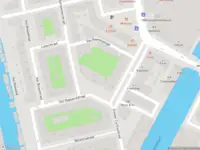 Ambulance met grote spoed naar de Donker Curtiusstraat in Amsterdam
