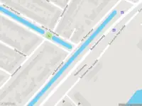 Ambulance met grote spoed naar de Schielands Hoge Zeedijk in Gouda