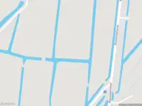 Ambulance met grote spoed naar de Dorpsstraat Holysloot in Amsterdam
