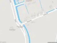 Brandweer met grote spoed naar de Nieuweweg in Rhoon vanwege personen te water