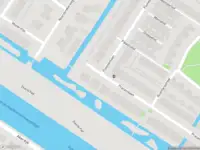 Ambulance met gepaste spoed naar de Pracanalaan in Amsterdam