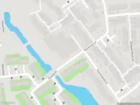 Ambulance met grote spoed naar de Ina Damman erf in Capelle aan den IJssel