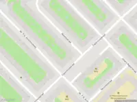 Ambulance met gepaste spoed naar de Newtonstraat in Amsterdam