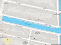 Ambulance met grote spoed naar de Prinsengracht in Amsterdam