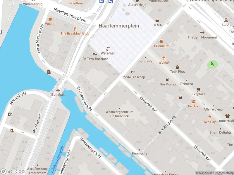 Ambulance met grote spoed naar de Nieuwe Wagenstraat in Amsterdam