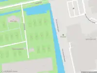 Ambulance met grote spoed naar de IJsbaanpad in Amsterdam